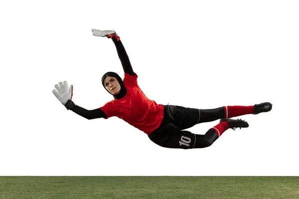 Arabian female soccer or football player, goalkeeper on white studio background — 스톡 사진