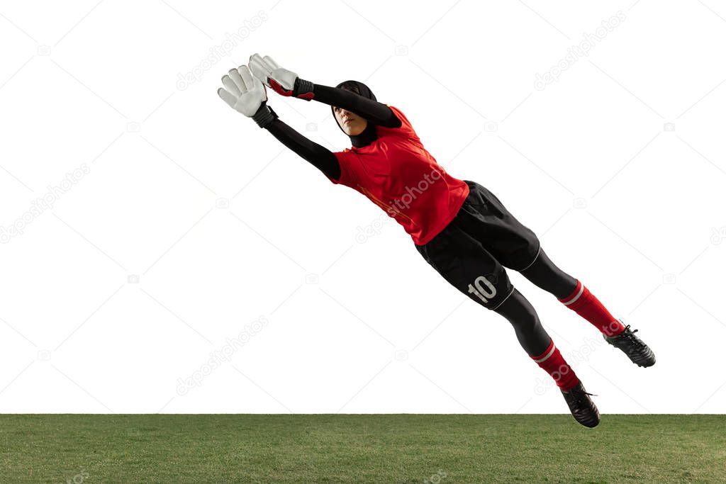 Arabian female soccer or football player, goalkeeper on white studio background