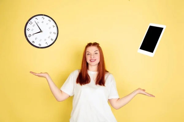 Caucasian young womans portrait on yellow background, too much tasks — 스톡 사진