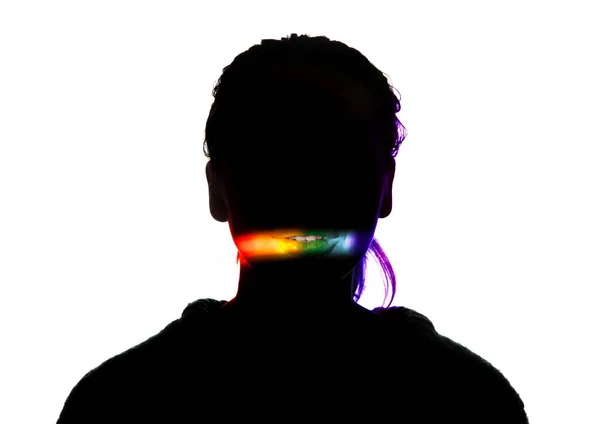 Dramatic portrait of a girl in the dark on white studio background with rainbow colored line — 스톡 사진