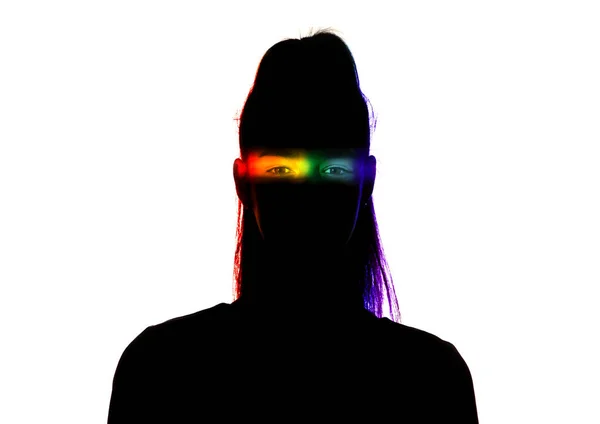 Dramatic portrait of a girl in the dark on white studio background with rainbow colored line — Stock Photo, Image
