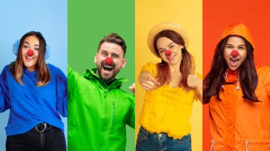 Portrait of young people celebrating red nose day on colorful background
