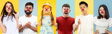 Portrait of young people celebrating red nose day on colorful background