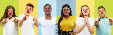 Portrait of young people celebrating red nose day on colorful background