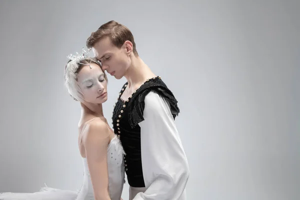 Young graceful couple of ballet dancers on white studio background — Stock Photo, Image