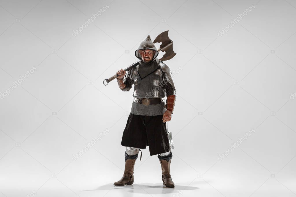 Brave armored knight fighting isolated on white studio background