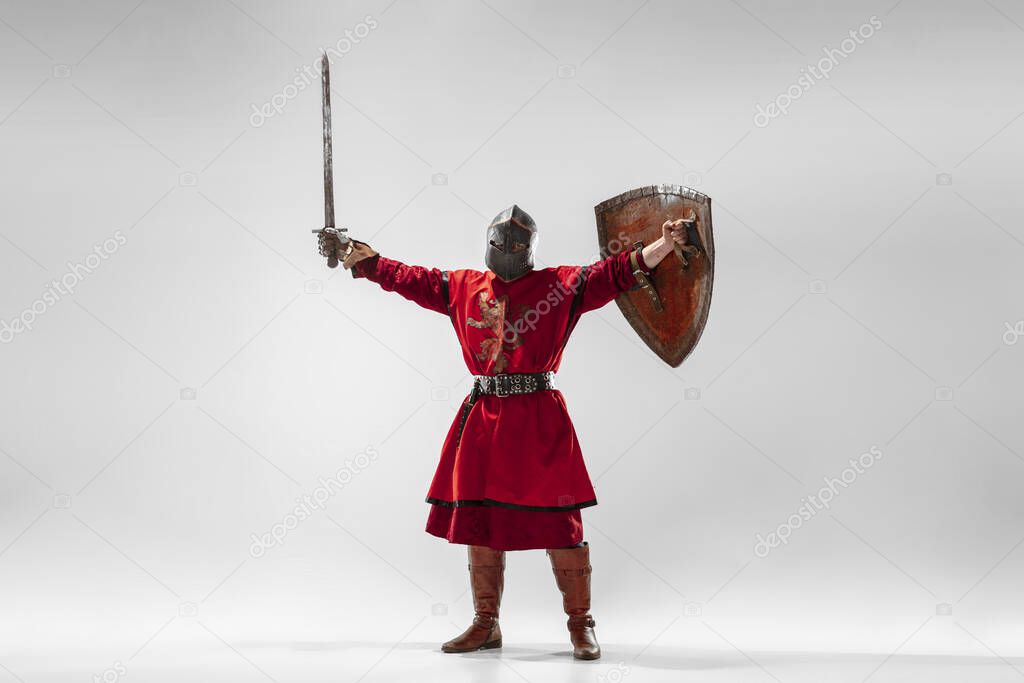 Brave armored knight fighting isolated on white studio background