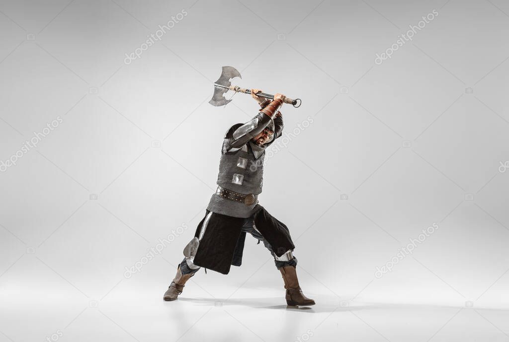 Brave armored knight fighting isolated on white studio background