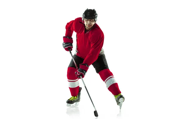 Male hockey player with the stick on ice court and white background — Stock Photo, Image