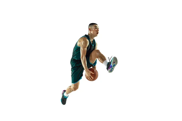 Young basketball player training isolated on white studio background — Stock Photo, Image