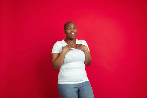 African-american young womans portrait on red background — Stock Fotó