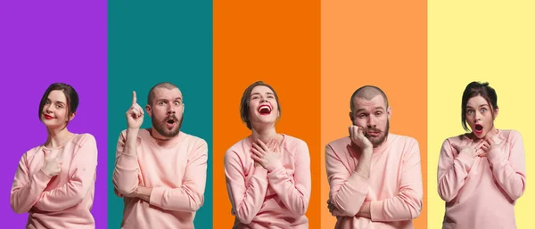 Portrait of group of emotional people on multicolored background — 图库照片