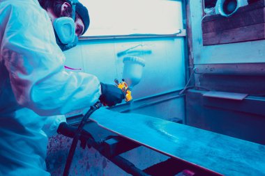 Skater in process of making his own skateboard, longboard - open business concept
