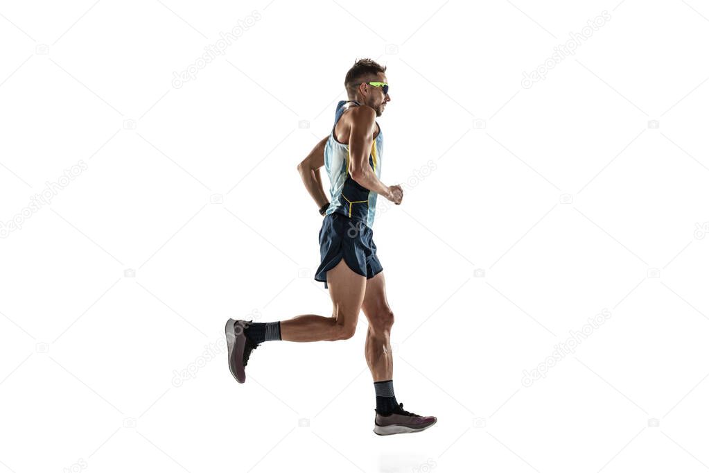 Triathlon male athlete running isolated on white studio background