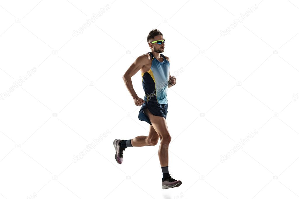 Triathlon male athlete running isolated on white studio background