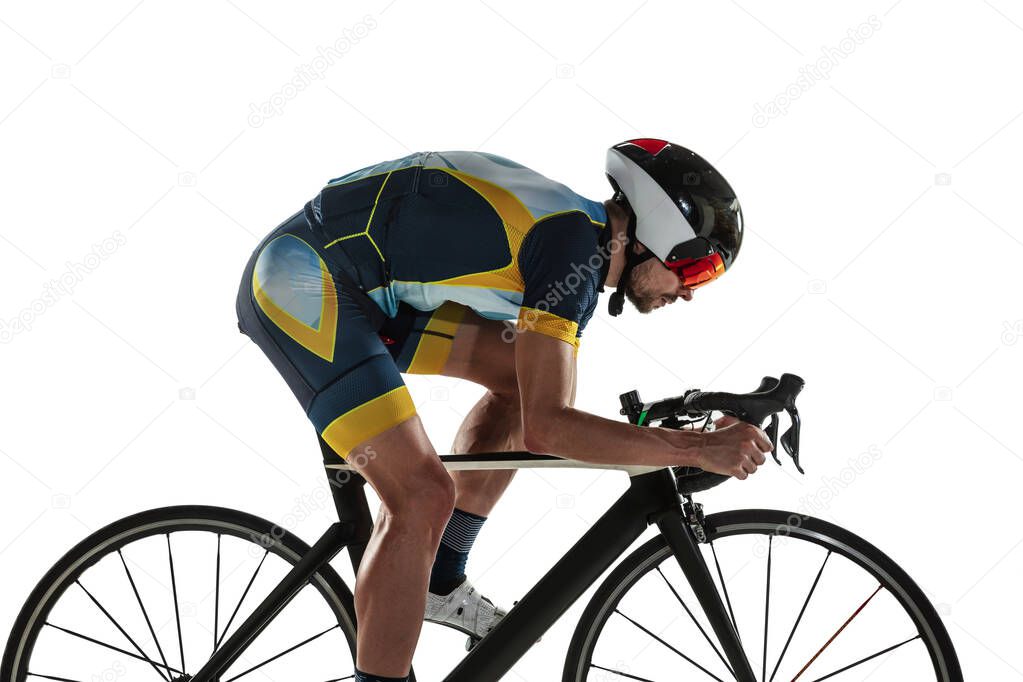 Triathlon male athlete cycle training isolated on white studio background