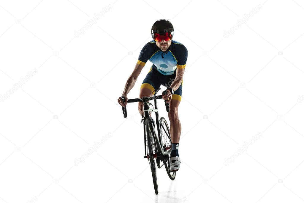 Triathlon male athlete cycle training isolated on white studio background