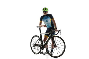 Triathlon male athlete cycle training isolated on white studio background clipart
