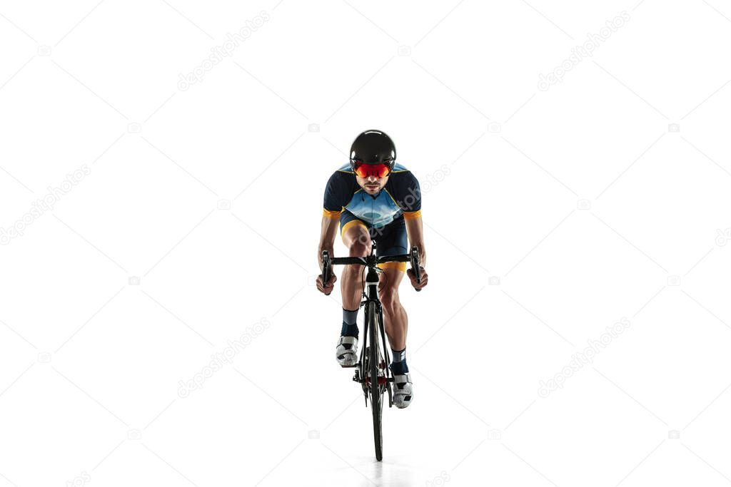 Triathlon male athlete cycle training isolated on white studio background