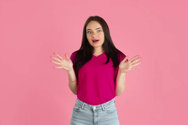 Monochrome portrait of young caucasian brunette woman on pink background — Stock Photo, Image