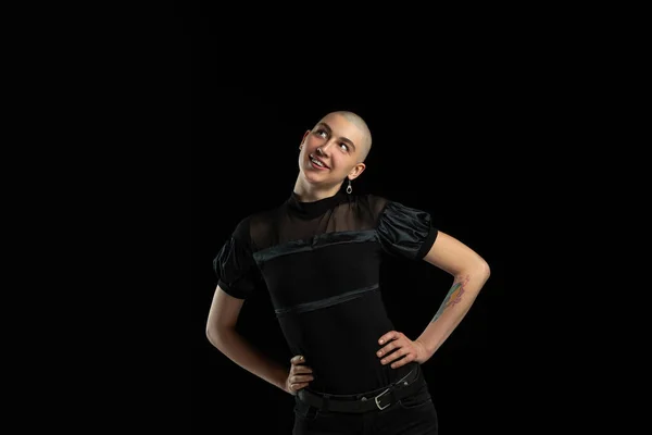 Monochrome portrait of young caucasian bald woman on black background — Stock Photo, Image
