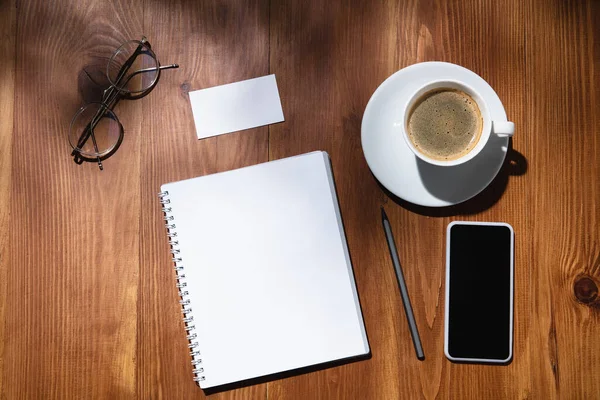 Creative and cozy workplace at home office, inspirational mock up with plant shadows on table surface — Stock Photo, Image