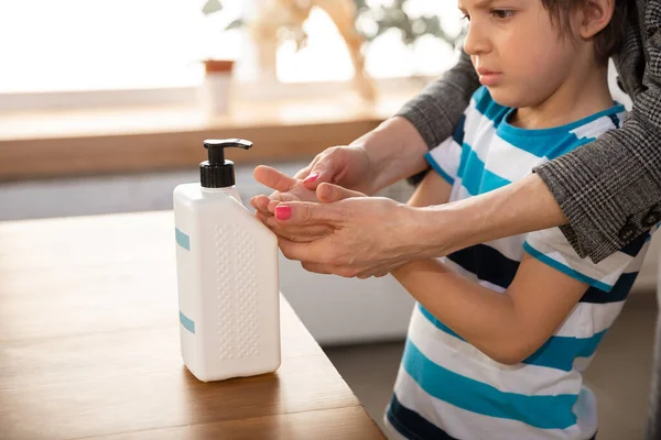 Mother washing hands her son carefully in bathroom close up. Prevention of infection and pneumonia virus spreading — Stock Photo, Image