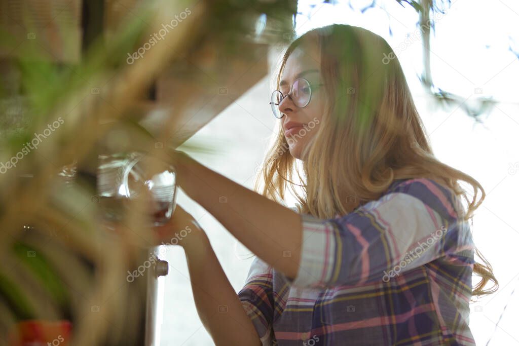 Portrait of gorgeous woman at home, cozy atmosphere, calm