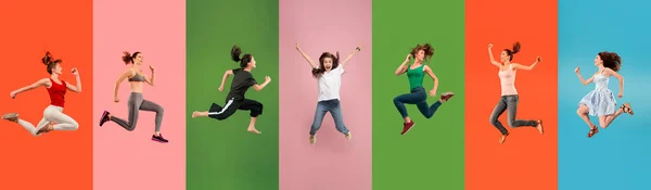 Giovani emotivi che saltano in alto, sembrano felici e allegri su sfondo multicolore — Foto Stock
