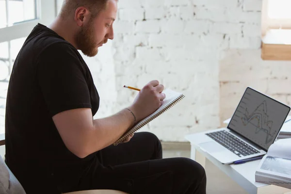 Young man studying at home during online courses for programmer, bug-tester, consulter — Stock Photo, Image