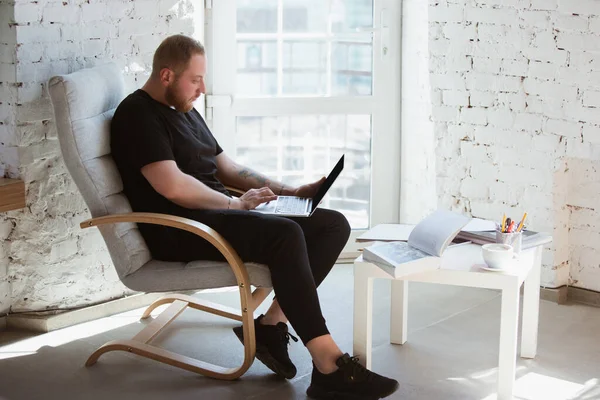 Young man studying at home during online courses for programmer, bug-tester, consulter — Stock Photo, Image