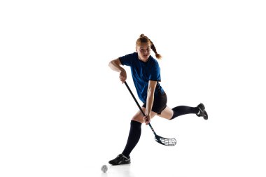 Floorball female player isolated on white studio background, action and motion concept clipart
