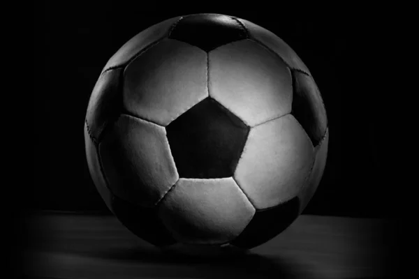 Professional sport equipment isolated on black studio background. Soccer ball.