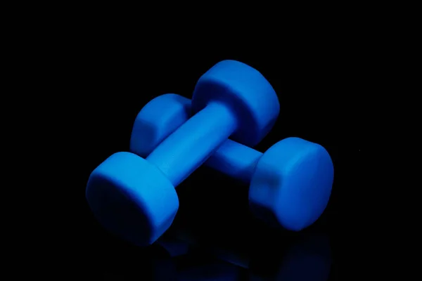 Professional sport equipment isolated on black studio background. Blue gym weights. — Stock Photo, Image