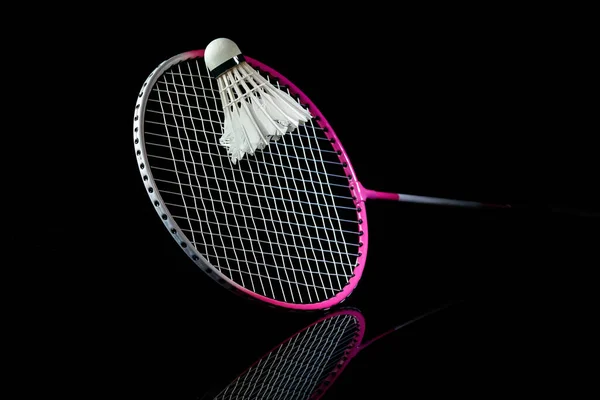 Professional sport equipment isolated on black studio background. Badminton racket.