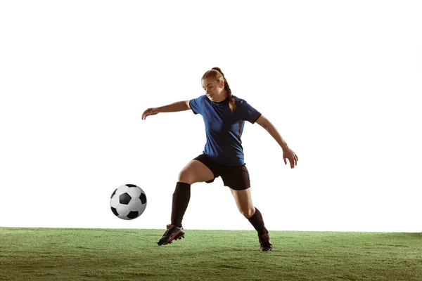 Futebol feminino, jogador de futebol chutando bola, treinamento em ação e movimento com emoções brilhantes isoladas no fundo branco — Fotografia de Stock