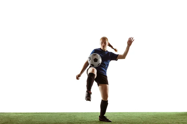 Female soccer, football player kicking ball, training in action and motion with bright emotions isolated on white background — Stock Photo, Image