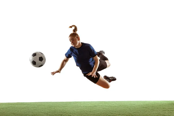 Futebol feminino, jogador de futebol chutando bola, treinamento em ação e movimento com emoções brilhantes isoladas no fundo branco — Fotografia de Stock