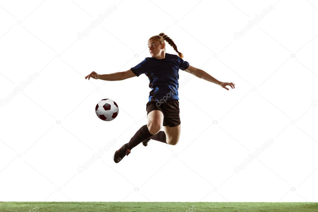 Female soccer, football player kicking ball, training in action and motion with bright emotions isolated on white background