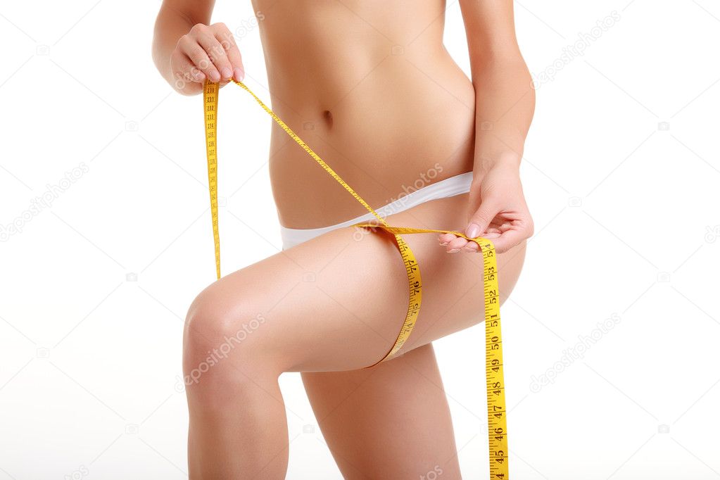 Woman measuring perfect shape of beautiful hips