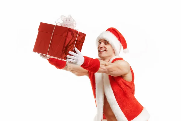 Cheerful fitness Santa holding a red box — Stock Photo, Image