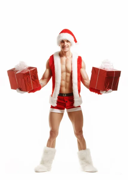 Σέξι γυμναστήριο Santa κρατώντας ένα κόκκινο κουτιά — Φωτογραφία Αρχείου