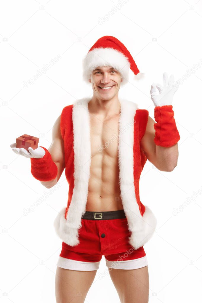 Cheerful fitness Santa showing OK