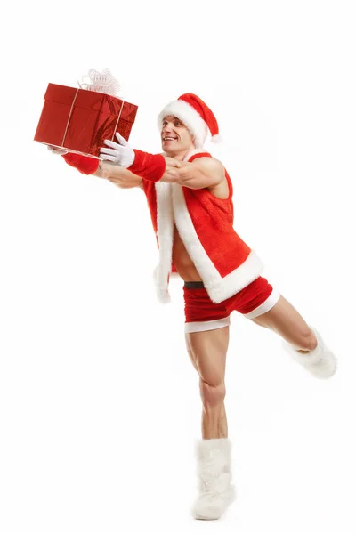 Cheerful fitness Santa Claus holding a red box — Stock Photo, Image