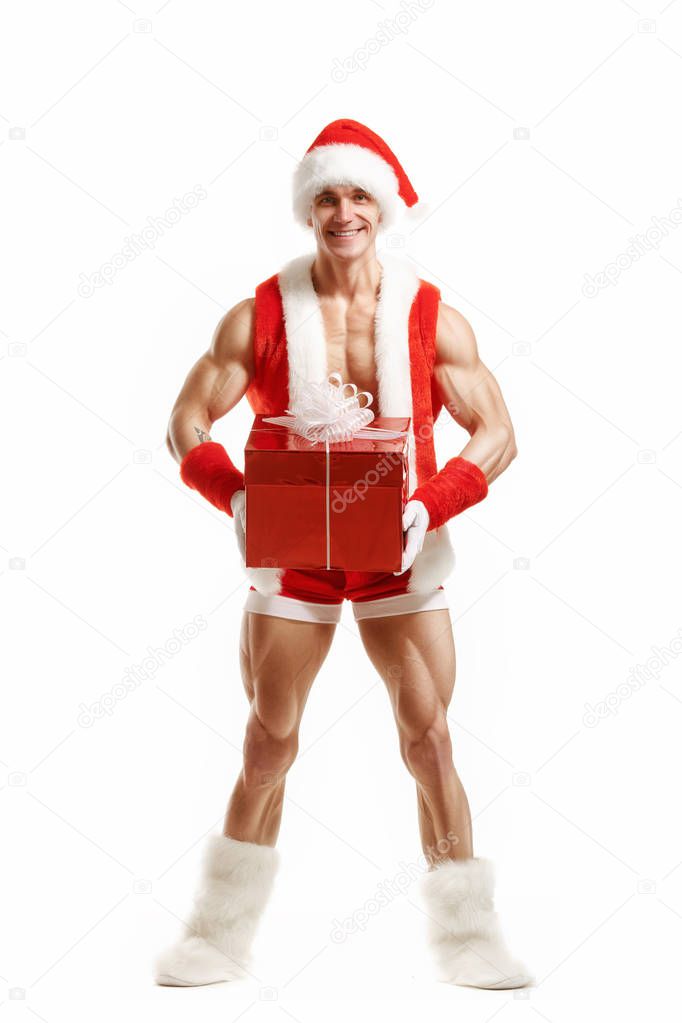Fitness Santa Claus holding a red box
