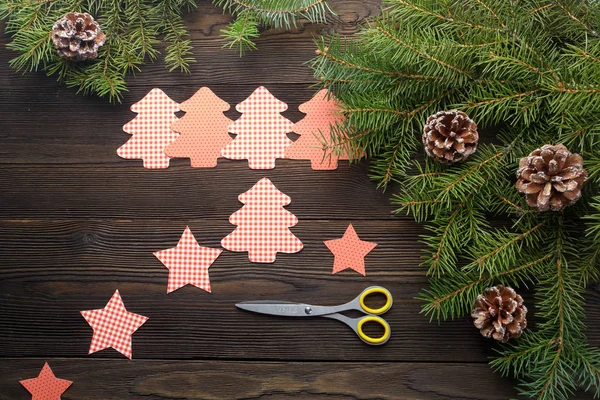 Cardboard Christmas figure on a wooden background — Stock Photo, Image