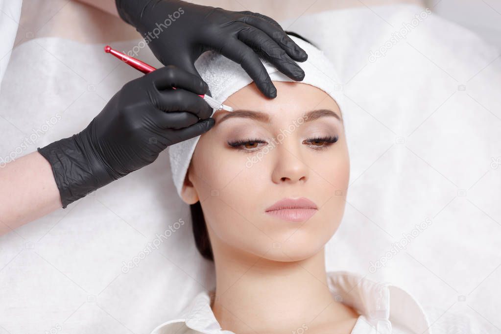 Permanent makeup eyebrows.