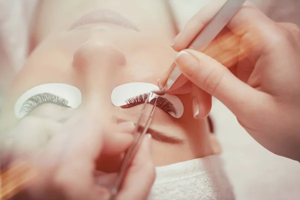 Eyelash Extension Procedure. Woman Eye with Long Eyelashes — Stock Photo, Image