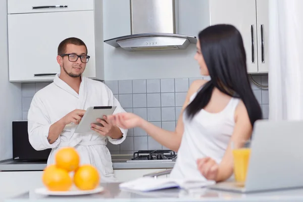 Couple talking each other at kitchen in morning. — Stock Photo, Image