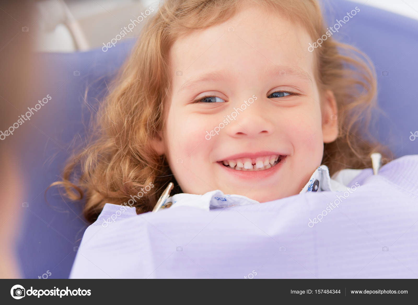 Smiling girl at dentist Stock Photo by ©lyashik 157484344